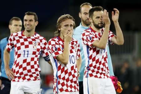 Football Soccer - Croatia v Portugal - EURO 2016 - Round of 16 - Stade Bollaert-Delelis, Lens, France - 25/6/16 (L-R) Croatia's Darijo Srna, Luka Modric and Milan Badelj looks react after the game REUTERS/Charles Platiau/ Livepic