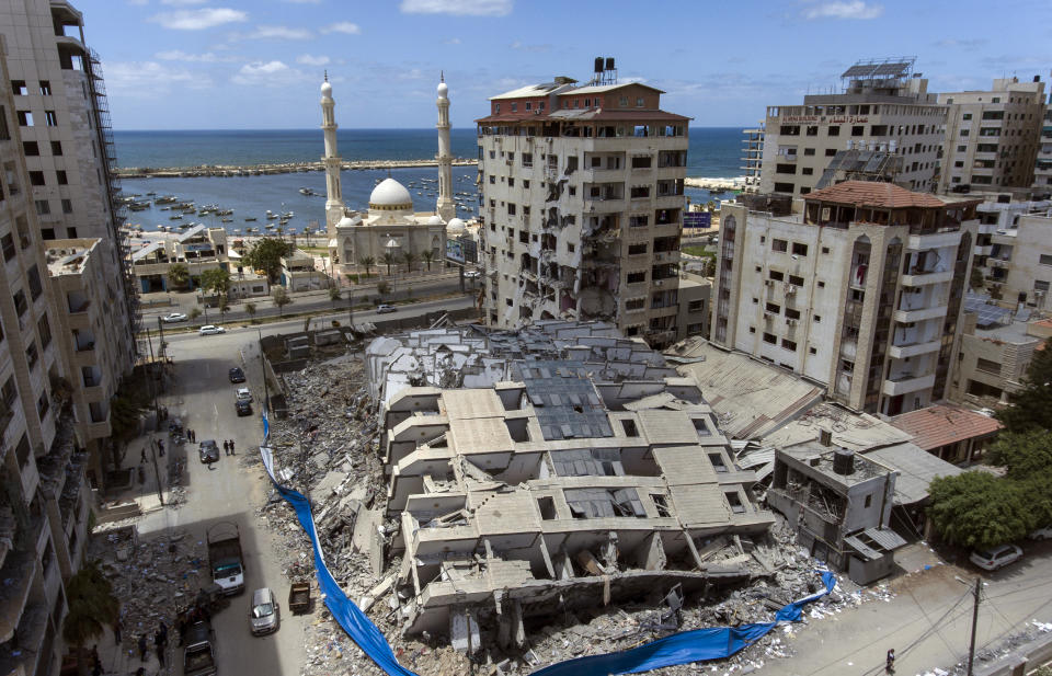 Rubble of a destroyed building scatters the ground after it was hit last week by Israeli airstrikes, in Gaza City, Saturday, May 22, 2021. (AP Photo/Khalil Hamra)