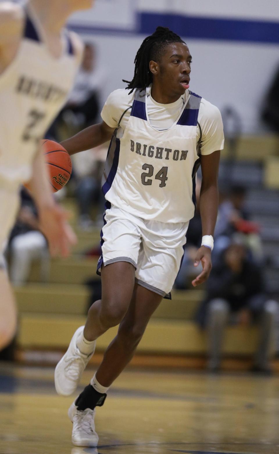 Brighton's Reginald Smith Jr. brings the ball up court.