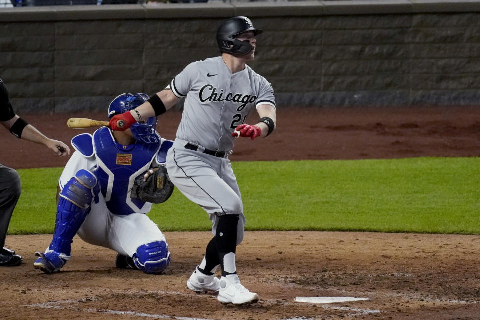 Chicago White Sox's Zack Collins watches his solo home run during the fifth inning of the team's baseball game against the Kansas City Royals on Friday, May 7, 2021, in Kansas City, Mo. (AP Photo/Charlie Riedel)