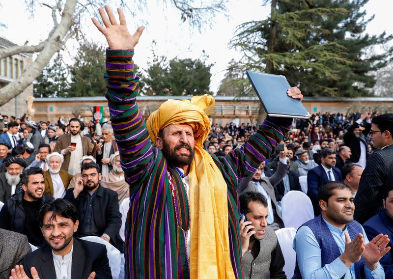 A supporter of Afghanistan's President Ashraf Ghani chant slogans during his inauguration as president, in Kabul