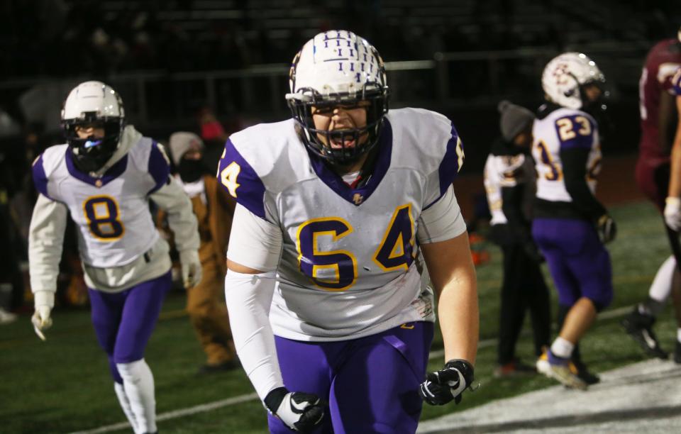 Bloom-Carroll's Zane Gogolin celebrates the Bulldogs' 33-28 win over Watterson in the Division III, Region 11 final Nov. 18 at DeSales.