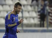 Andriy Yarmolenko of Ukraine celebrates his goal against U.S. during an international friendly match at Antonis Papadopoulos stadium in southern city of Larnaca, Cyprus, Wednesday, March 5, 2014. The Ukrainians are facing the United States in a friendly in Cyprus, a match moved from Kharkiv, Ukraine, to Larnaca for security reasons. (AP Photo/Petros Karadjias)