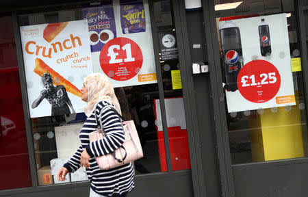 Prices are displayed on a store window in London, Britain May 16, 2017. REUTERS/Neil Hall