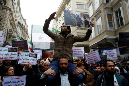 Syrians living in Istanbul gather in front of the Russian Consulate during a protest in Istanbul, Turkey February 22, 2018. REUTERS/Osman Orsal