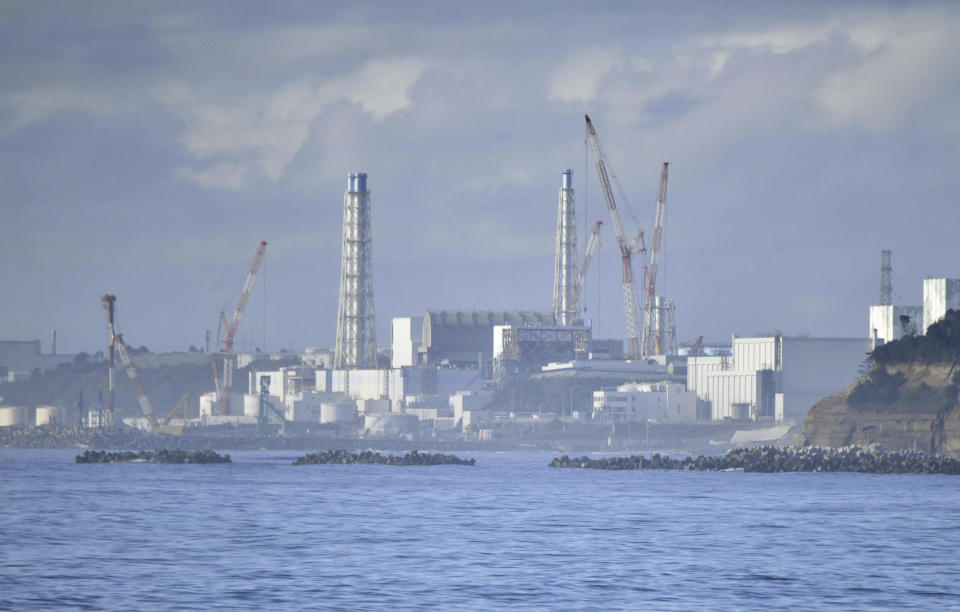 Fukushima Daiichi nuclear plant is seen from Namie, Fukushima prefecture, Japan Tuesday, Aug. 22, 2023. Japan will start releasing treated and diluted radioactive wastewater from the Fukushima Daiichi nuclear plant into the Pacific Ocean as early as Thursday, a controversial but essential early step in the decades of work to shut down the facility 12 years after its meltdown disaster. (Kyodo News via AP)