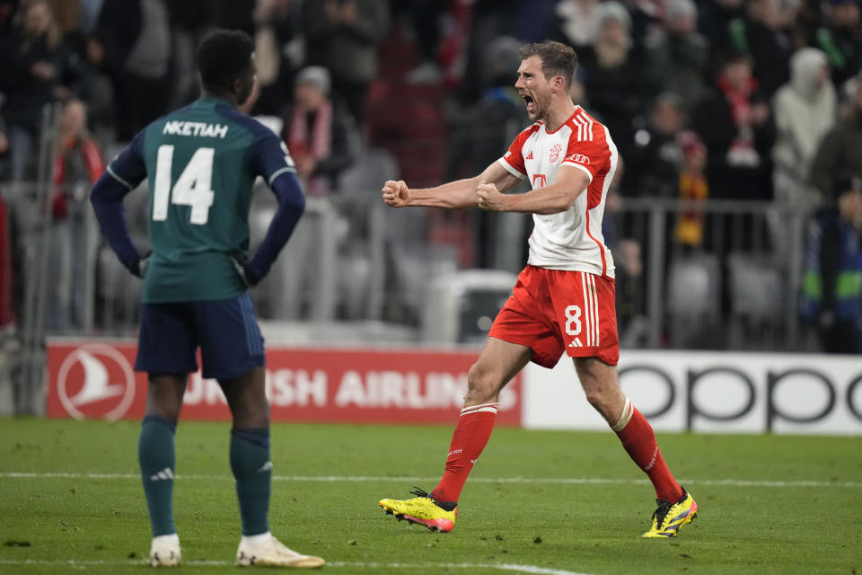 Arsenal's Eddie Nketiah, left, watches as Bayern's Leon Goretzka celebrates after the Champions League quarter final second leg soccer match between Bayern Munich and Arsenal at the Allianz Arena in Munich, Germany, Wednesday, April 17, 2024. (AP Photo/Matthias Schrader)