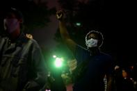 A demonstrator raises his fist during a rally after the death of Walter Wallace Jr., a Black man who was shot by police in Philadelphia