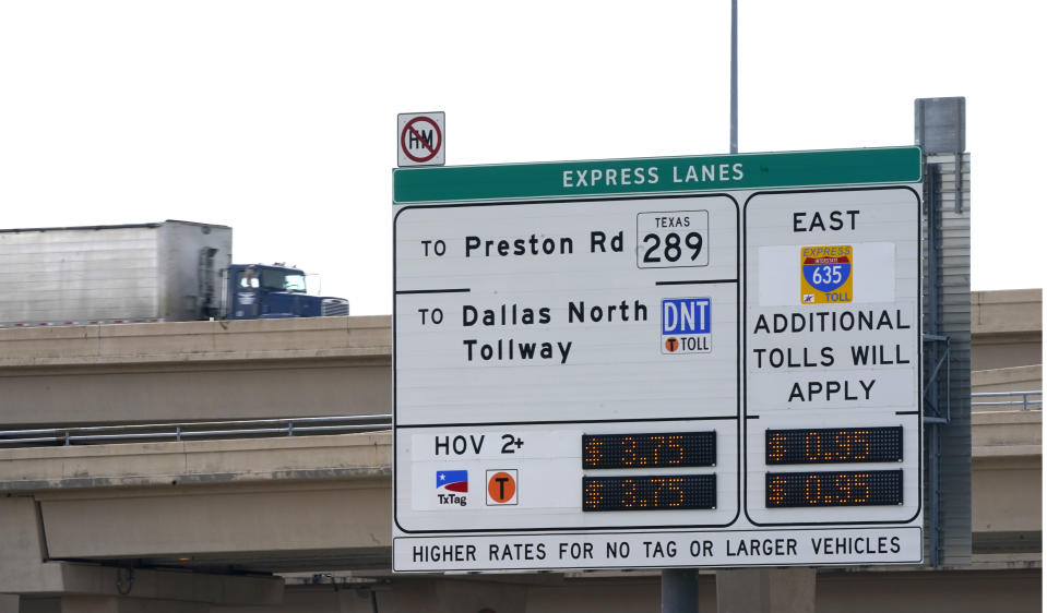 An express lanes highway sign marks an entrance in Dallas, Friday, March 3, 2023. There is growing interest in the South in fee-based express lanes in which some drivers can up to avoid congestion on highways where other drivers can access general lanes for free. (AP Photo/LM Otero)