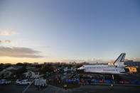 The space shuttle Endeavour sits in a strip mall near Los Angeles International Airport in Los Angeles, Friday, Oct. 12, 2012. Endeavour's 12-mile road trip kicked off shortly before midnight Thursday as it moved from its Los Angeles International Airport hangar en route to the California Science Center, its ultimate destination, said Benjamin Scheier of the center. (AP Photo/Jae C. Hong)