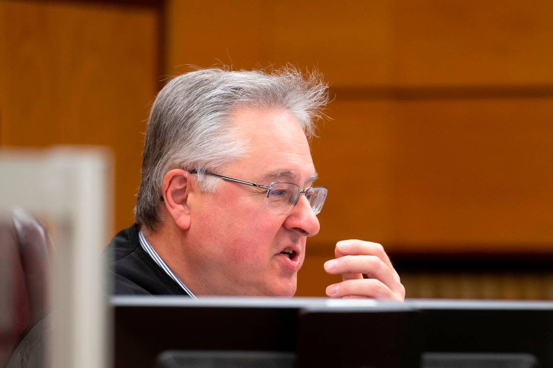 Pierce County Superior Court Judge Bryan Chushcoff deliberates whether to move the date of the trial for the Tacoma police officers charged with killing Manny Ellis. Photographed during a hearing on Friday, Dec. 2, 2022, at Pierce County Superior Court in Tacoma.