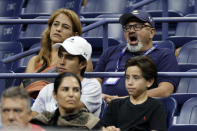 A fan yawns as he watches a match between Marin Cilic, of Croatia, and Carlos Alcaraz, of Spain, during the fourth round of the U.S. Open tennis championships, early Tuesday, Sept. 6, 2022, in New York. (AP Photo/Adam Hunger)