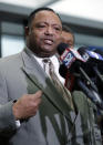 Rev. Marvin Hunter, Laquan McDonald's great-uncle, reacts as he speaks at to reporters after a judge acquitted three Chicago police officers of trying to cover up the 2014 shooting of black teenager Laquan McDonald, Thursday, Jan. 17, 2019, in Chicago. Judge Domenica Stephenson said that after considering all of the evidence, including police dashcam video of the killing, she didn't find that officer Thomas Gaffney, Joseph Walsh and David March conspired to cover up the shooting. The officer who shot McDonald 16 times, Jason Van Dyke, was convicted of murder in October and is due to be sentenced Friday.(AP Photo/Nam Y. Huh)