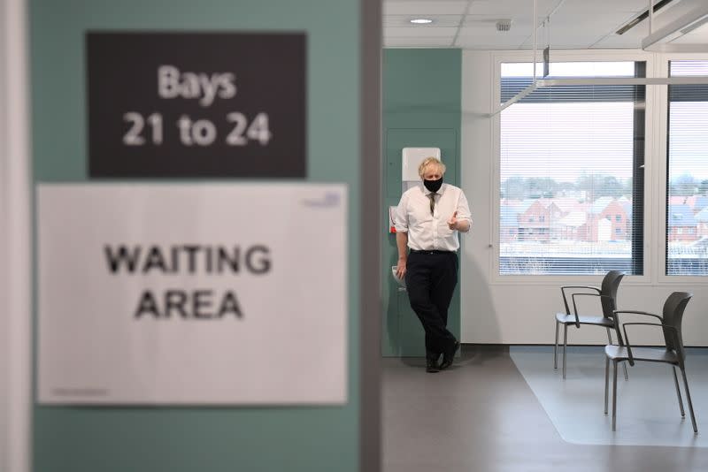 Britain's Prime Minister Boris Johnson visits the Chase Farm Hospital in north London