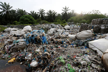 Scrap from an illegal plastic recycling factory are dumped near a palm oil plantation in Jenjarom, Kuala Langat, Malaysia October 14, 2018. Picture taken October 14, 2018. REUTERS/Lai Seng Sin