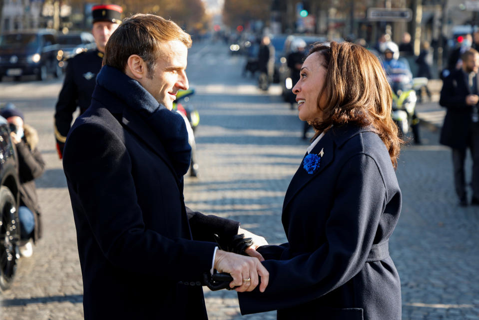 French President Emmanuel Macron speaks to Vice President Kamala Harris before ceremonies marking the 103rd anniversary of Armistice Day, Thursday, Nov. 11, 2021 in Paris. (Ludovic Marin, Pool via AP)