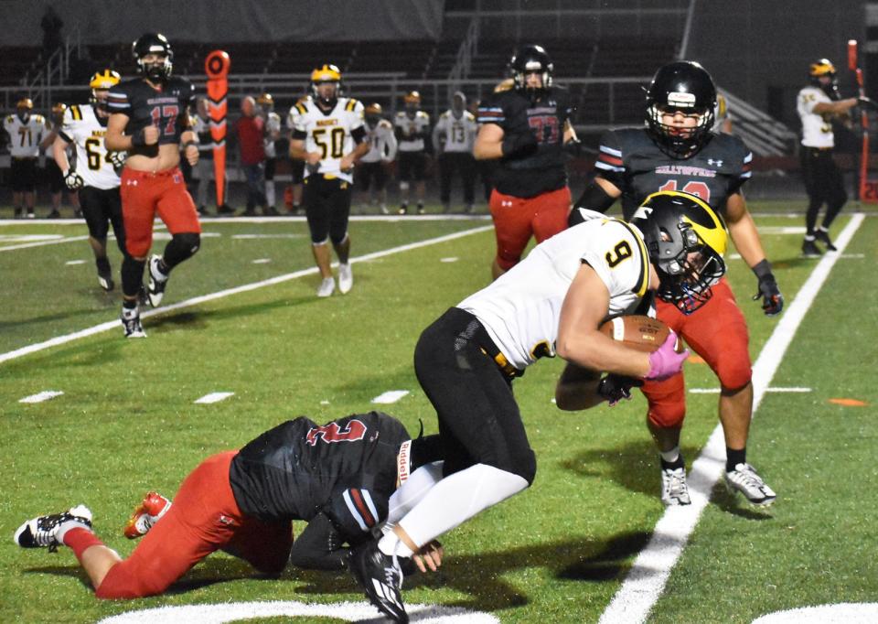 Durfee's Keith Strong takes down Nauset's Owen White during Friday's non-league game at B.M.C. Durfee High School Sept. 29, 2023
