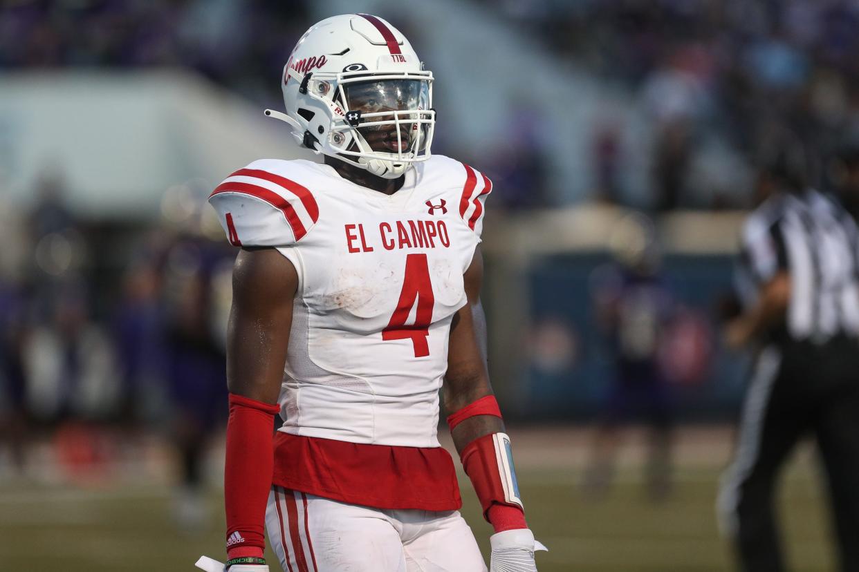 El Campo's Rueben Owens listens to coach during the game against Miller at Buccaneer Stadium on Friday, Sept. 2, 2022.