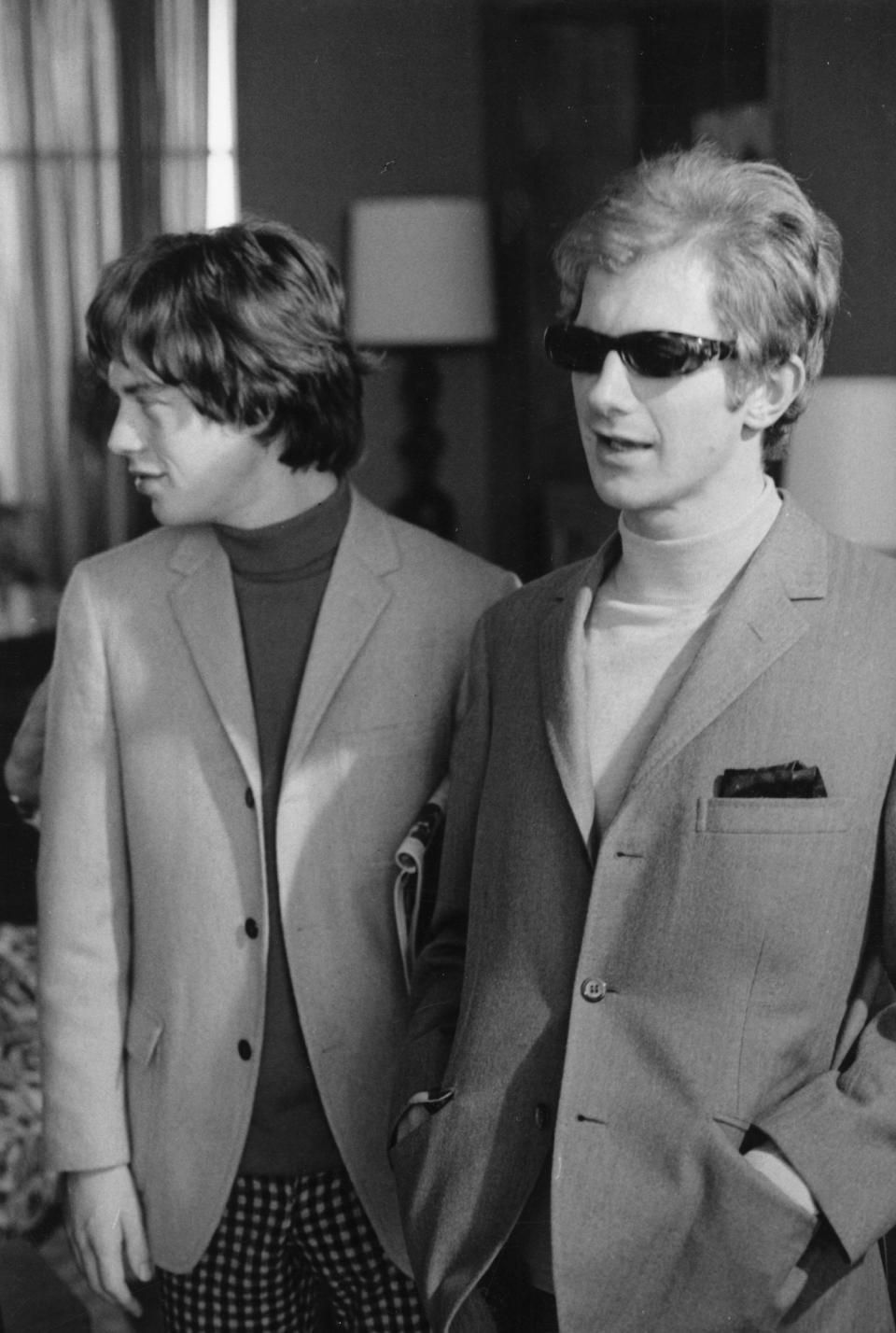 Mick Jagger and Rolling Stones manager Andrew Loog Oldham rocking a pair of smart three-button jackets in 1965.