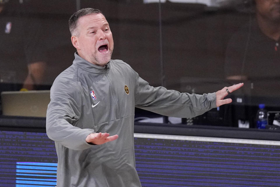 Denver Nuggets head coach Michael Malone yells to his players during the second half of an NBA conference final playoff basketball game against the Los Angeles Lakers Thursday, Sept. 24, 2020, in Lake Buena Vista, Fla. (AP Photo/Mark J. Terrill)