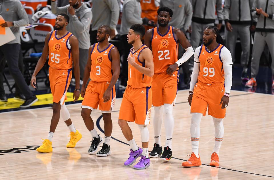 The Suns have been talking about competing for an NBA title, and they think players like Chris Paul (3) and Devin Booker can help carry them there.