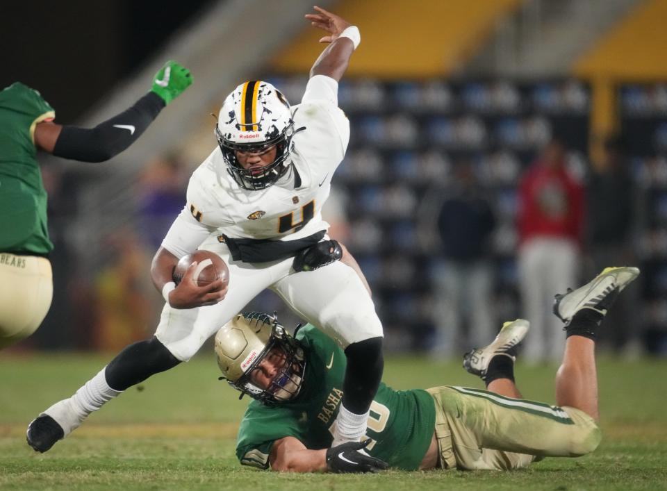 Dec 10, 2022; Tempe, AZ, USA; Saguaro quarterback Devon Dampier (4) tries to break away from Basha linebacker Patrick Green (40) during their Open Division State Championship at ASU Sun Devil Stadium.