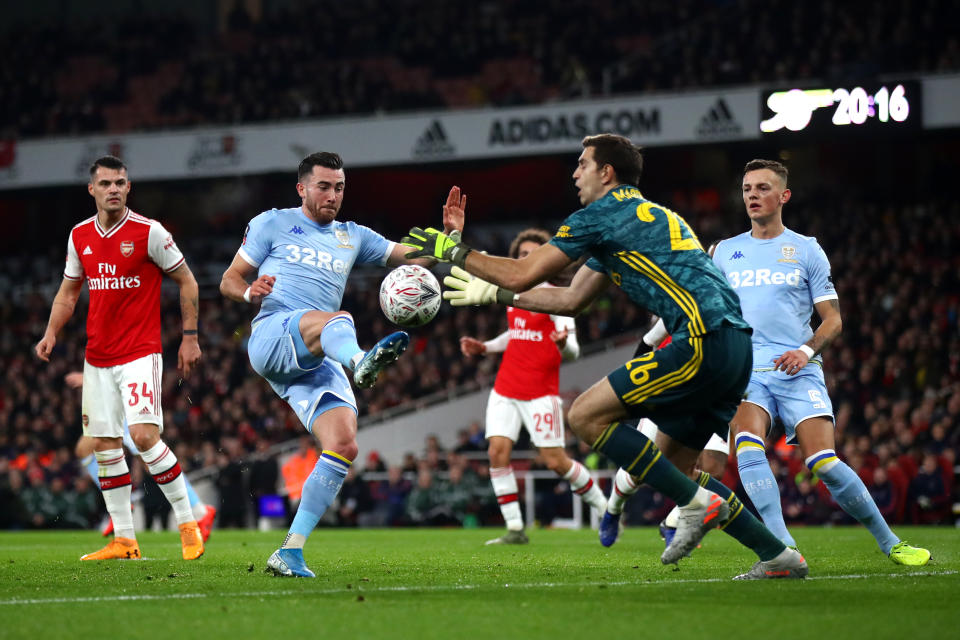 LONDON, ENGLAND - JANUARY 06:  Jack Harrison of Leeds United is closed down by Emiliano Martinez of Arsenal during the FA Cup Third Round match between Arsenal FC and Leeds United at the Emirates Stadium on January 06, 2020 in London, England. (Photo by Julian Finney/Getty Images)