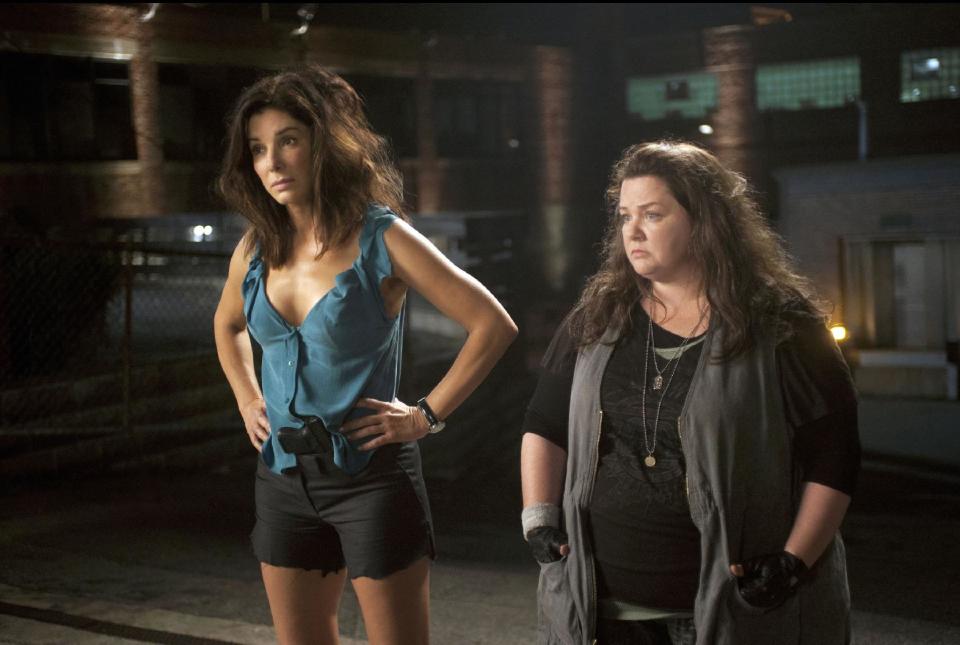 This film publicity image released by 20th Century Fox shows Sandra Bullock as FBI Special Agent Sarah Ashburn, left, and Melissa McCarthy as Boston Detective Shannon Mullins in a scene from "The Heat." (AP Photo/20th Century Fox, Gemma La Mana)