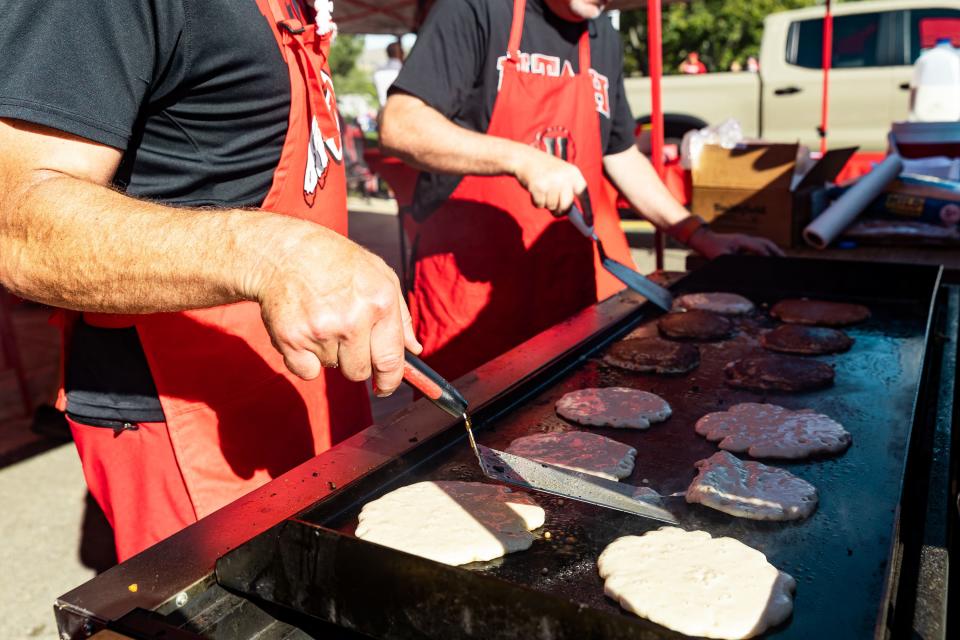 Left to right, Frank Compagni and James Roberts make pancakes while tailgating before the Utah verses Weber State football game at Rice-Eccles Stadium in Salt Lake City on Saturday, Sept. 16, 2023. | Megan Nielsen, Deseret News