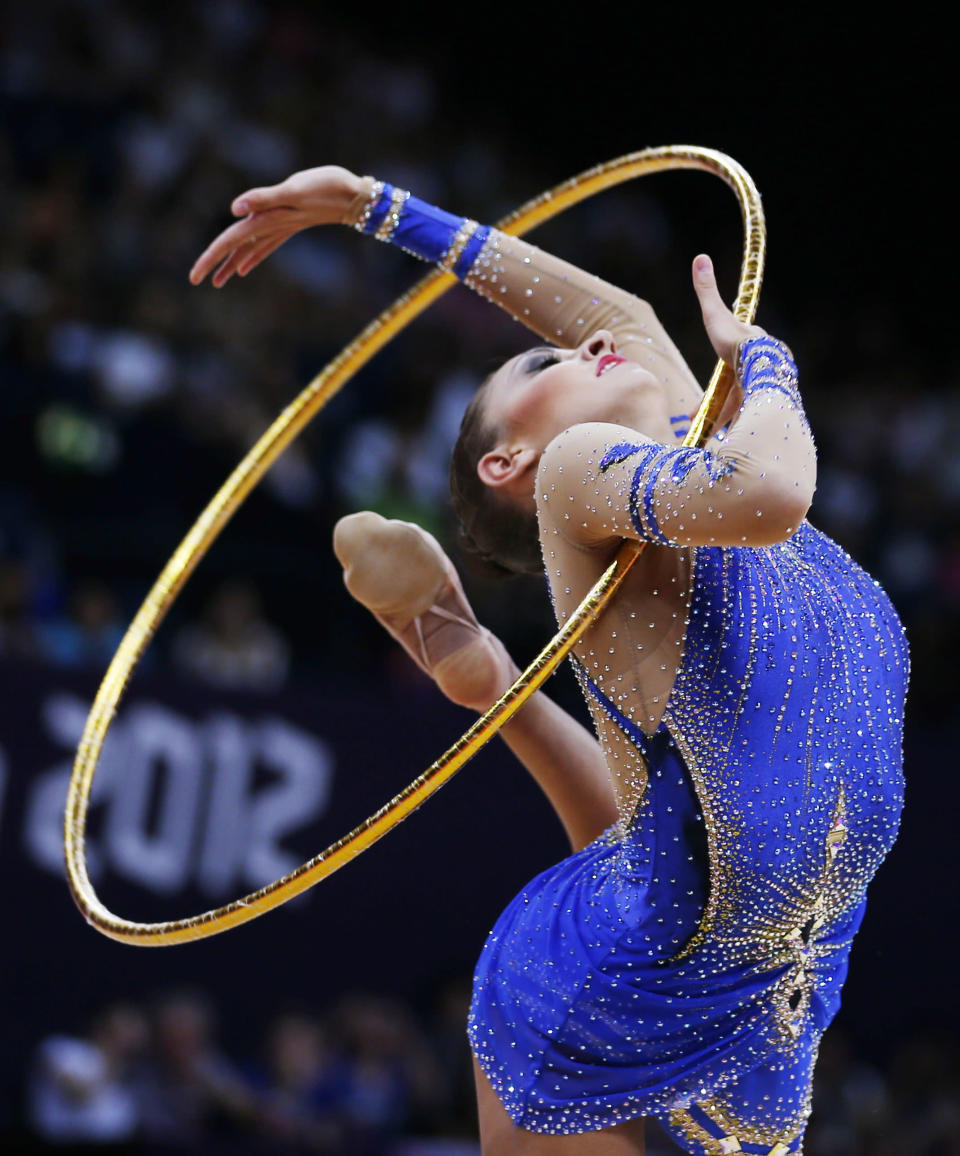 俄羅斯韻律體操女王Evgeniya Kanaeva以116.900分成為史上第一位成功衛冕韻律體操全能金牌的選手。(圖片來源：達志影像)