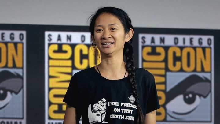 Chloe Zhao speaking with the backdrop of San Diego ComicCon.