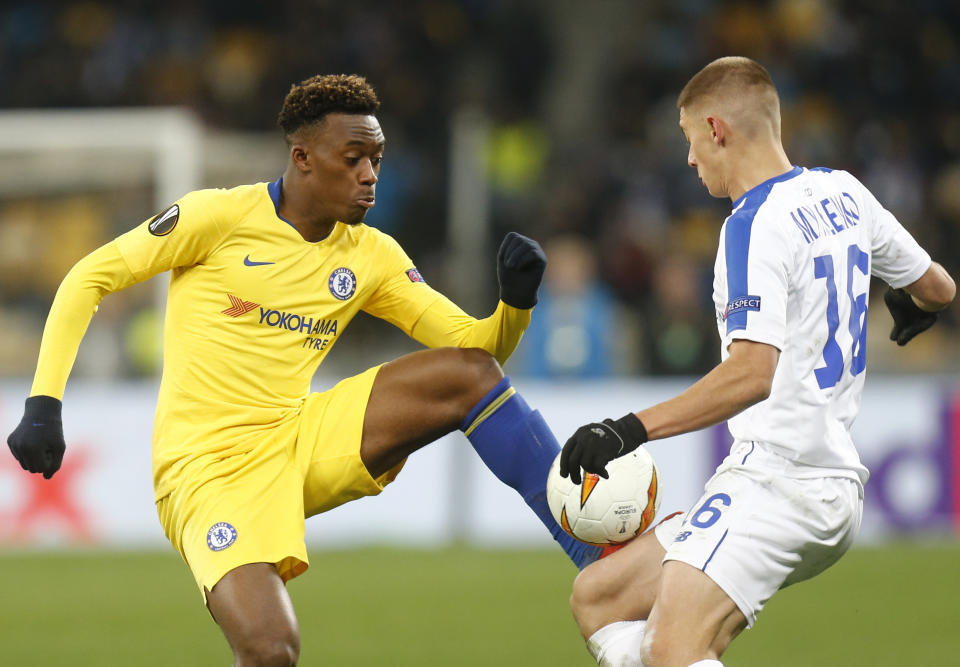 Chelsea's Davide Hudson-Odoi, left, and Dynamo Kiev's Vitaliy Mykolenko challenge for the ball during the Europa League round of 16, second leg soccer match between Dynamo Kiev and Chelsea at the Olympiyskiy stadium in Kiev, Ukraine, Thursday, March 14, 2019. (AP Photo/Efrem Lukatsky)