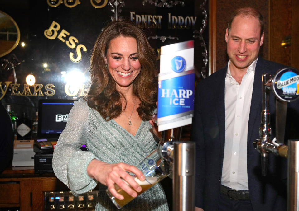 Kate laughs as she pulls a pint at Belfast’s Empire Music Hall. (Photo: PA)