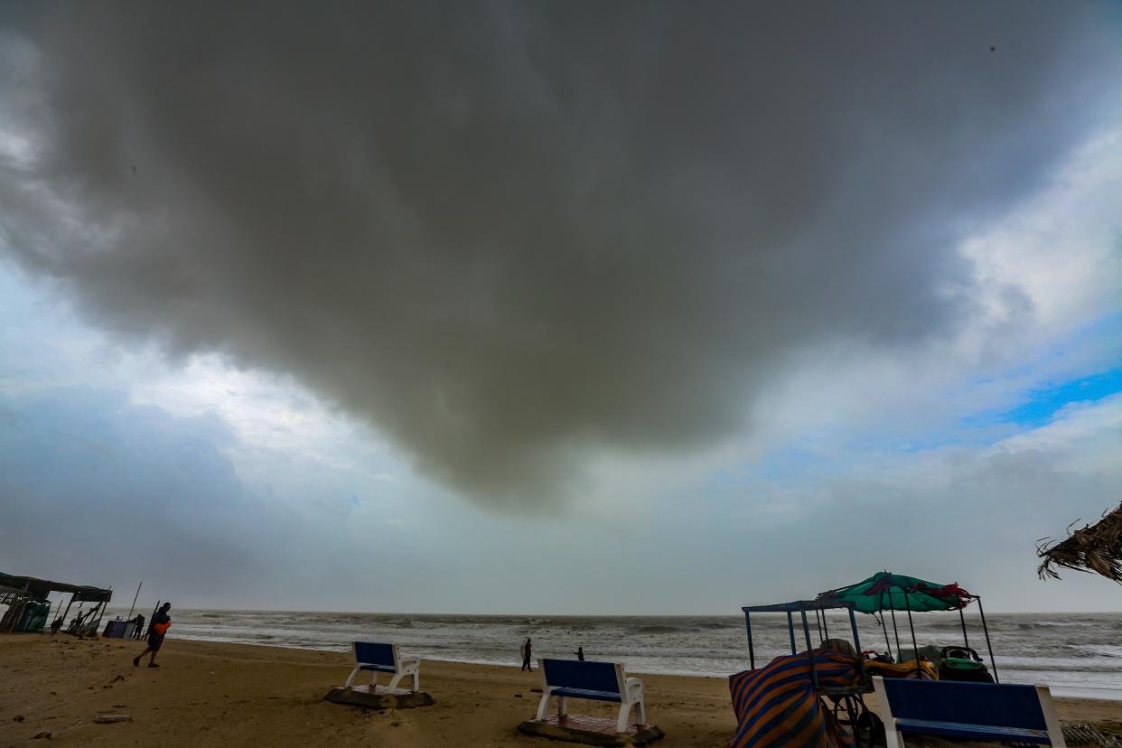 A cloud shapes above a deserted beach in Mandvi, in the Kutch district of the western state of Gujarat, India (EPA)