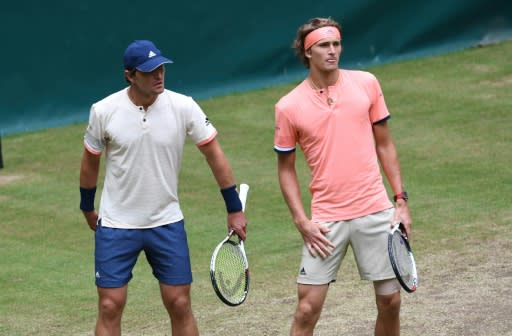 Brothers Mischa (L) and Alexander Zverev of Germany, seen during a doubles match at a tournament in Halle, in June 2018