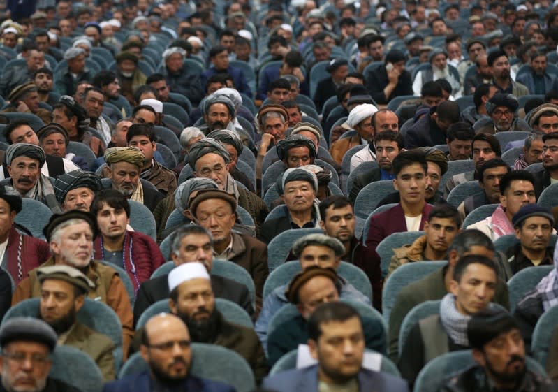 Supporters of presidential candidate Abdullah Abdullah attend a gathering in Kabul