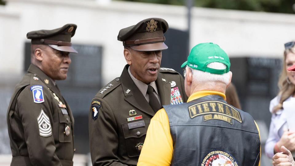 Gen. Charles Hamilton, commander of Army Materiel Command, shakes hands Monday with retired Capt. Mike Rose, a Medal of Honor recipient, during Huntsville’s Memorial Day Ceremony and Laying of Wreaths at the Huntsville Madison County Veterans Memorial. (Jonathan Stinson/Army)