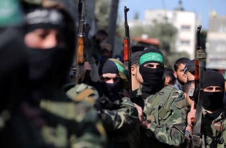 Palestinian Hamas militants take part in the funeral of their comrade Mahmoud Al-Nabaheen during his funeral in the central Gaza Strip January 23, 2019. REUTERS/Ibraheem Abu Mustafa