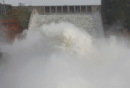 Water is released from the Lake Oroville Dam after an evacuation was ordered for communities downstream from the dam in Oroville, California. REUTERS/Jim Urquhart