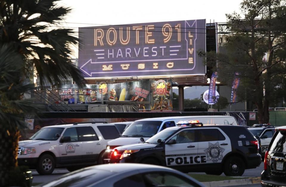 Las Vegas Metropolitan Police in front of a sign for the Route 91 Harvest festival (EPA)