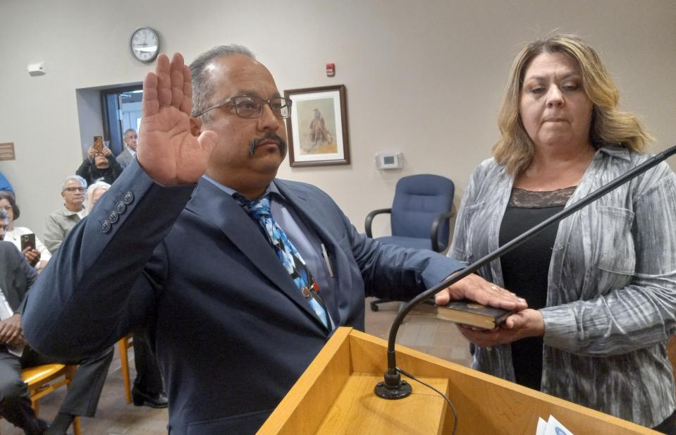 Incoming Carlsbad Mayor Richard Lopez (left) is sworn into office for 2024 as Carlsbad City Clerk Nadine Mireles holds the Holy Bible on Dec. 28, 2023. Lopez took the oath office starting Jan. 1, 2024.