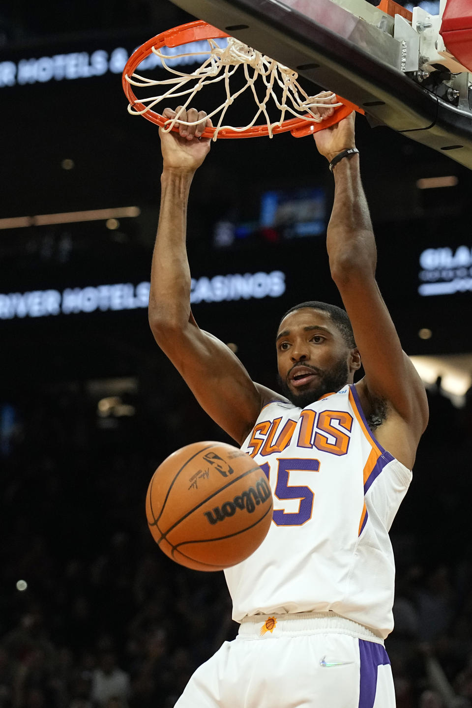 Phoenix Suns forward Mikal Bridges (25) dunks against the Sacramento Kings during the second half of an NBA basketball game, Wednesday, Oct. 27, 2021, in Phoenix. Sacramento won 110-107. (AP Photo/Rick Scuteri)
