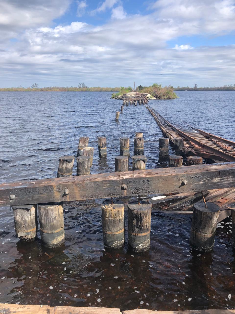The train bridge crossing the Caloosahatchee River was significantly damaged by Hurricane Ian on Sept. 28, 2022.
