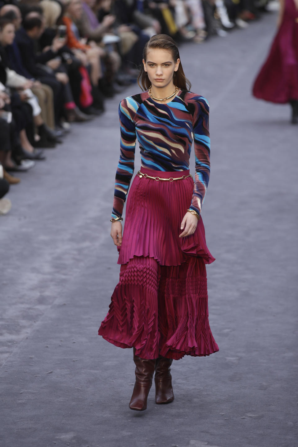 A model wears a creation as part of the Roberto Cavalli women's Fall-Winter 2019-2020 collection, that was presented in Milan, Italy, Saturday, Feb.23, 2019. (AP Photo/Luca Bruno)