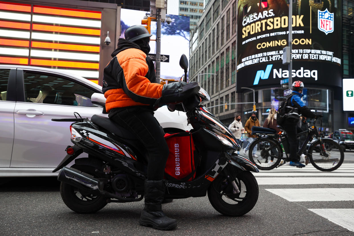 NEW YORK, NY - DECEMBER 29: A food delivery guy with scooter is seen at the Times Square in New York City, United States on December 29, 2021. (Photo by Tayfun Coskun/Anadolu Agency via Getty Images)