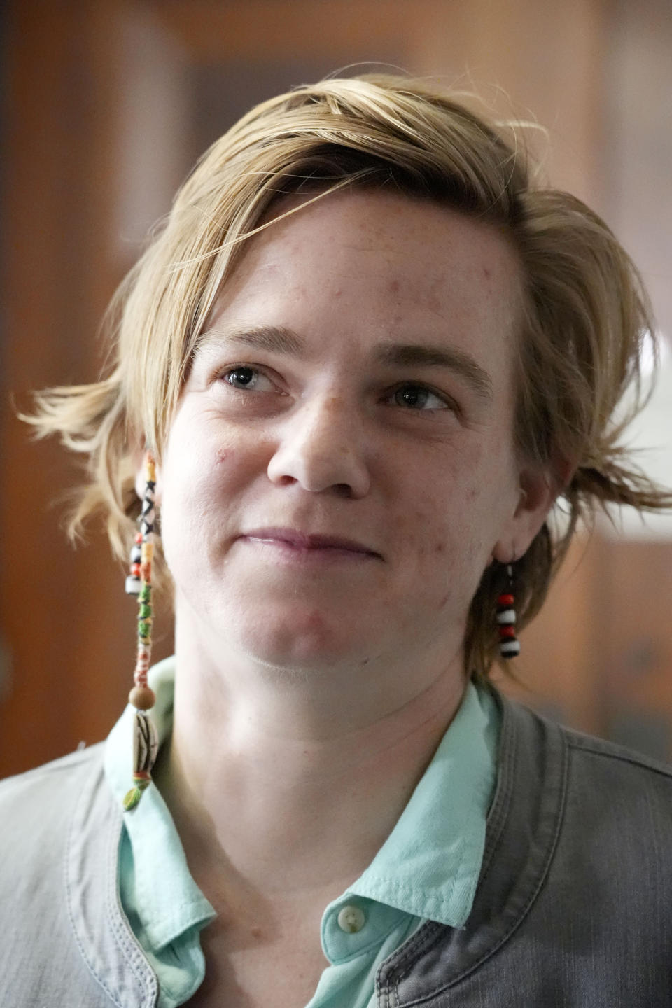 Karissa Bowley, widow of Dau Mabil, a 33-year-old Jackson, Miss., resident who went missing on March 25 and whose body was found in April floating in the Pearl River in Lawrence County, listens to a reporter's question following a hearing, on whether a judge should dissolve or modify his injunction preventing the release of Mabil's remains until an independent autopsy could be conducted, Tuesday, April 30, 2024, in Jackson, Miss. (AP Photo/Rogelio V. Solis)