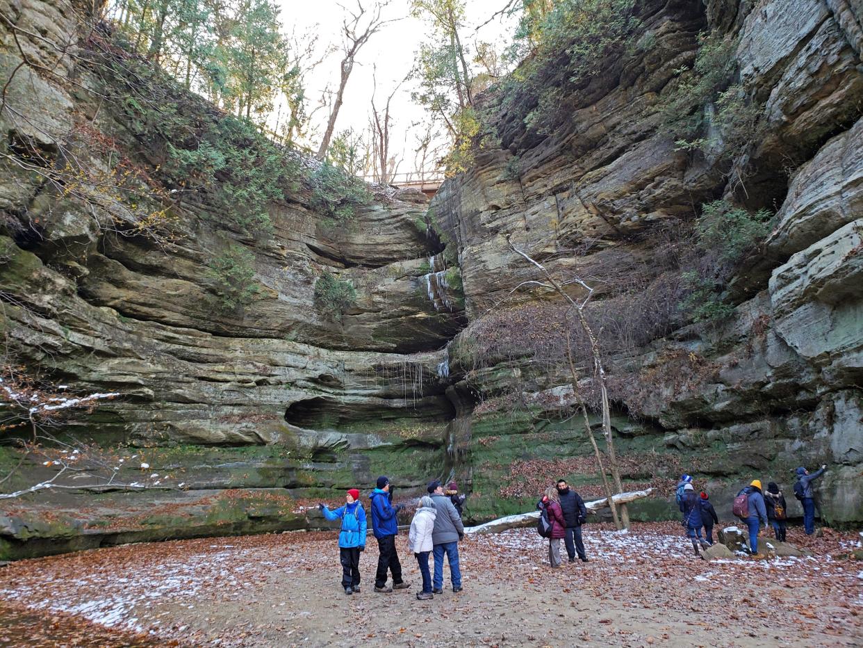 Hikers explore Wildcat Canyon in Starved Rock State Park outside Utica, Illinois.