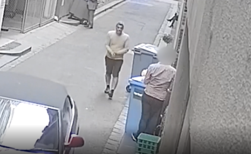 The man can be seen approaching the unwitting victim in the laneway. Source: Vic Police