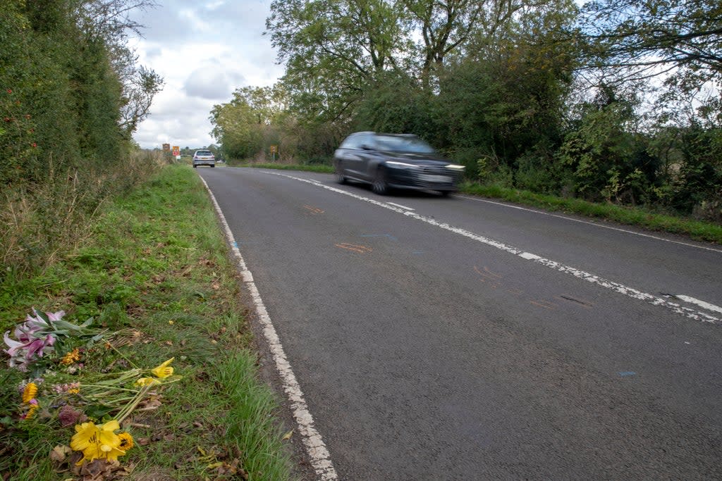 Floral tributes on the B4031 outside RAF Croughton where Harry Dunn died (Steve Parsons/PA) (PA Archive)