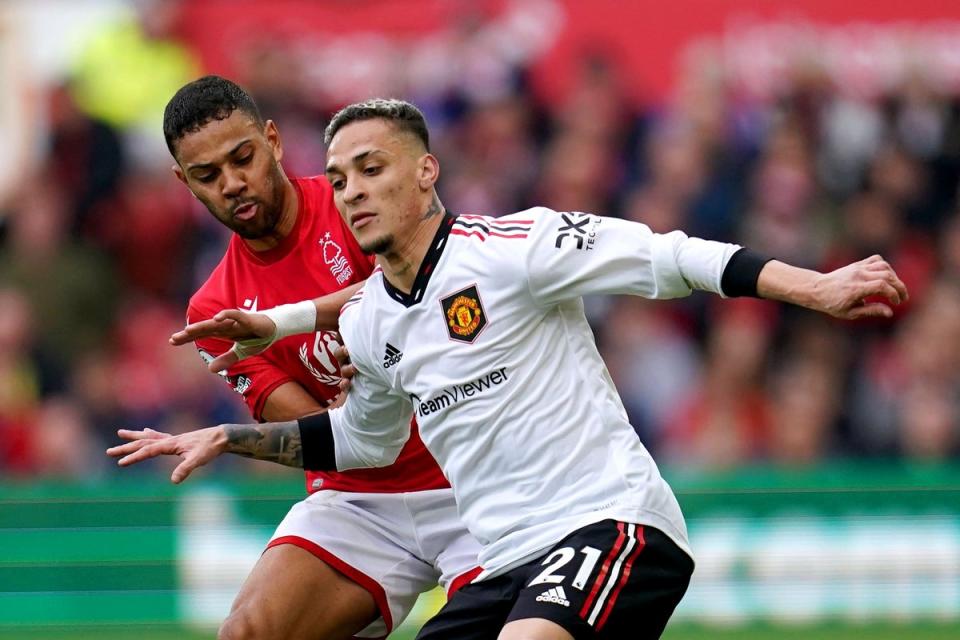 Manchester United’s Antony (right) and Nottingham Forest’s Renan Lodi battle for the ball during the Premier League match at the City Ground, Nottingham. Picture date: Sunday April 16, 2023. (PA Wire)